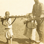 "War In the Rif: Children with Rifles (1923)" by The Casas-Rodríguez Postcard Collection on Flickr (CC BY-NC-ND 2.0)